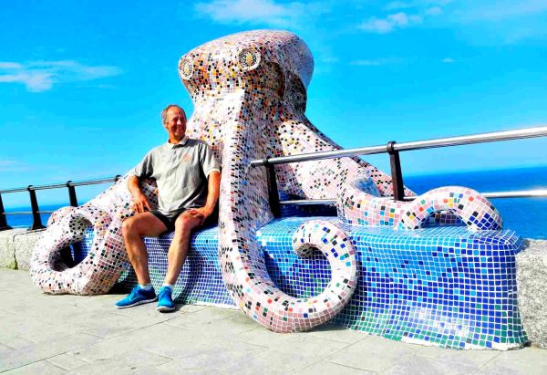 Soren  Hugged by Octopus Sculpture